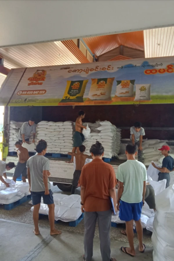 earthquake relief supplies being loaded on a large truck