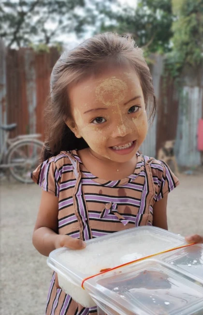 young girl receiving ready made meal