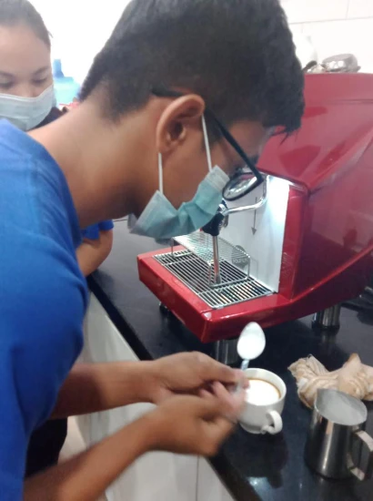 SISU trainees learning coffee art