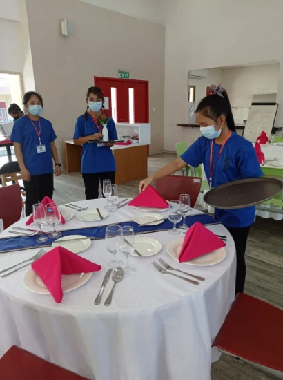 SISU trainees setting the table