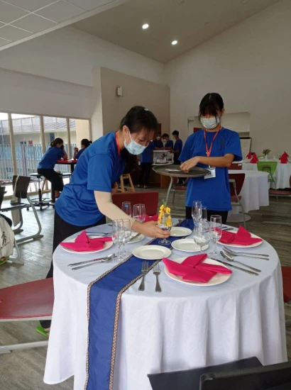 SISU trainees setting table