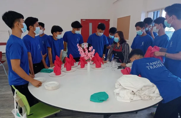 SISU trainees learning table setting procedures