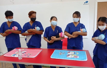 SISU trainees learning infant care