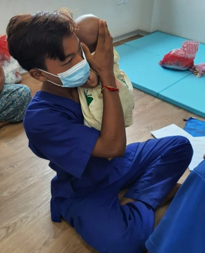SISU trainees learning baby and child care comforting