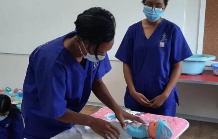 SISU trainees learning infant care