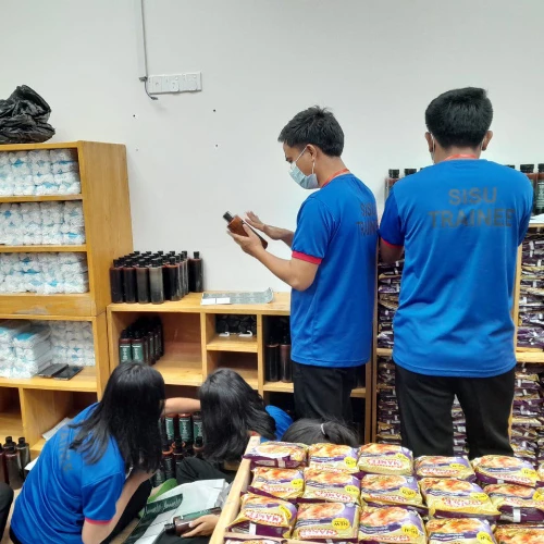SISU trainees learning about stocking shelves and inventory management
