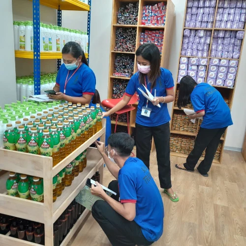 SISU trainees learning about stocking shelves and inventory management